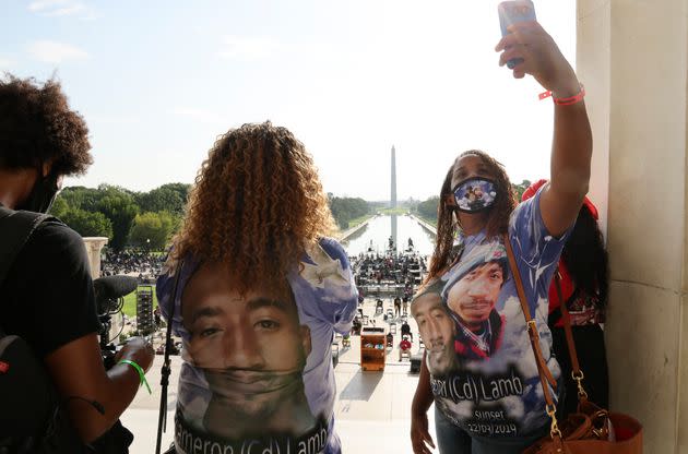 In this Aug. 28, 2020 photo, Laurie Bey, right, whose son Cameron Lamb was shot and killed by Kansas City police in 2019, stands with Merlon Ragland, Cameron's aunt, as demonstrators gather at the Lincoln Memorial as final preparations are made for the March on Washington in Washington. The family of Lamb is suing Kansas City police and the officer. The Kansas City Star reports that the lawsuit was filed Monday, June 28, 2021, in federal court on behalf of 26-year-old Cameron Lamb's four minor children.