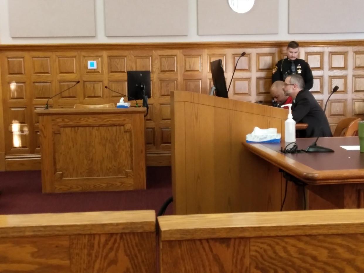 Willis R. Kennedy bows his head while he waits to be sentenced for killing Keith D. Greggs at the Girard Gardens apartment complex in Canton in June. Stark County Common Pleas Judge Natalie R. Haupt gave him a life sentence, with the possibility of parole after 15 years.