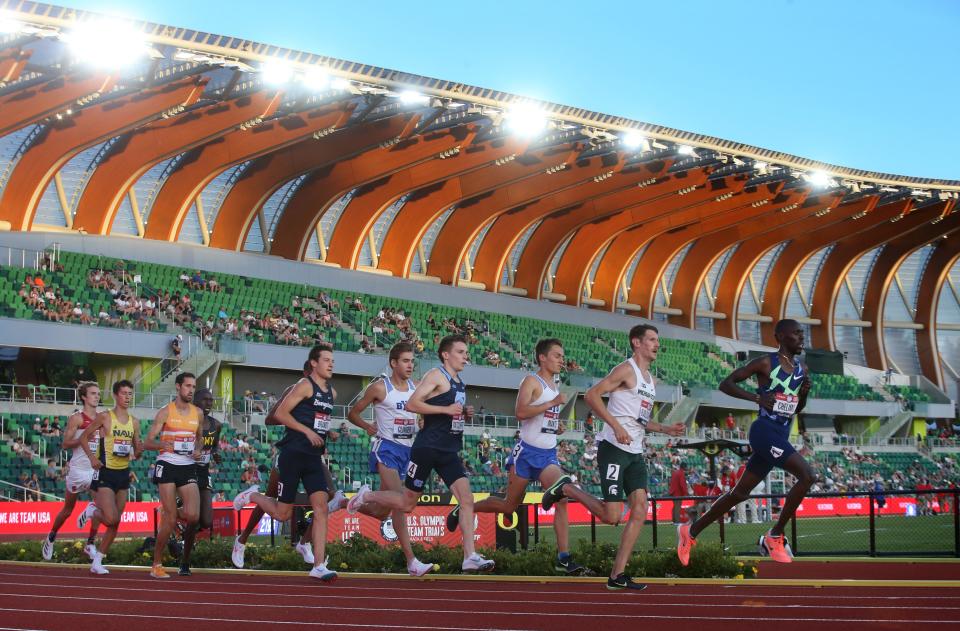 Men compete during the U.S. Olympic Track and Field Trials in June with Hayward Field's canopy made of mass timber in the backdrop. Mass timber, a category of wood construction material that can replace steel and concrete for primary load-bearing functions, is being used more often. The Oregon Mass Timber Coalition is competing for federal funding to help innovate housing construction.