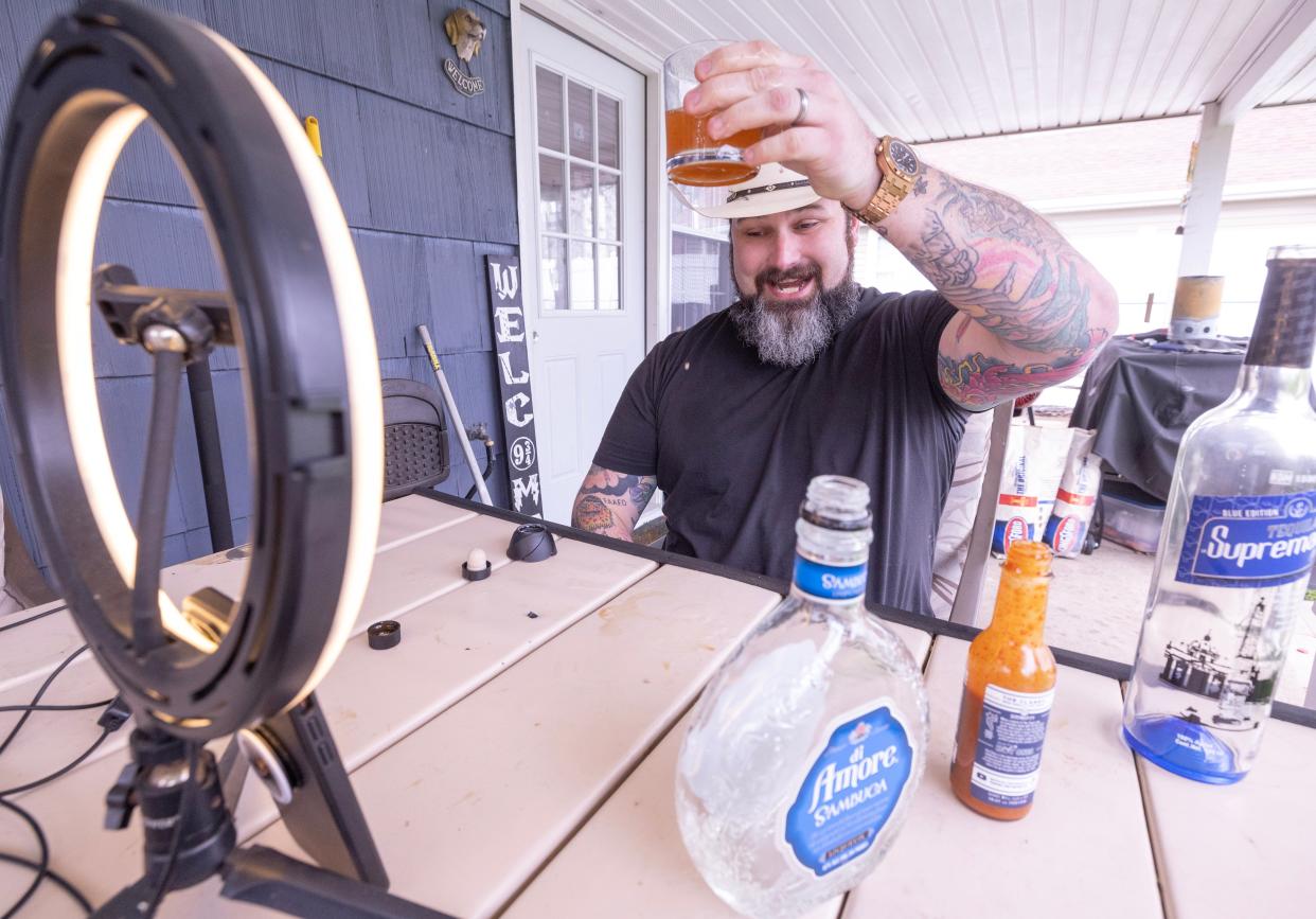 Ryan Shaner, a TikTok content creator and influencer, toasts a drink to his viewers. The Navarre resident posts cocktail review videos on TikTok under the handle of One Big Pike.