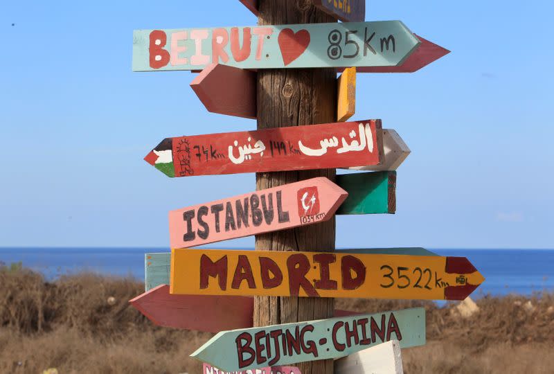 Signs bearing names of cities are pictured in Naqoura