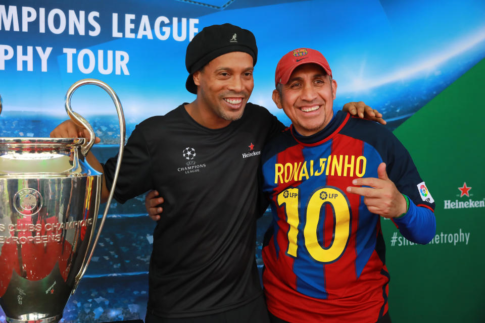 Ronaldinho meets a fan on the UEFA Champions League Trophy Tour presented by Heineken®