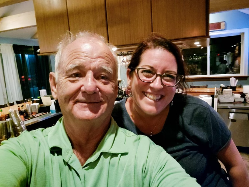 Bill Murray, left, poses with a staff member at Turk's Seafood while dining out on Sunday, Aug. 28.