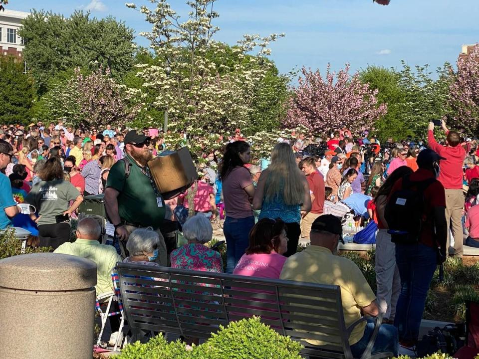 Hundreds gathered at a Rock Hill park ahead of a Sunday prayer vigil to honor the six people killed in a mass shooting last week, including four members of the Lesslie family and two AC technicians.