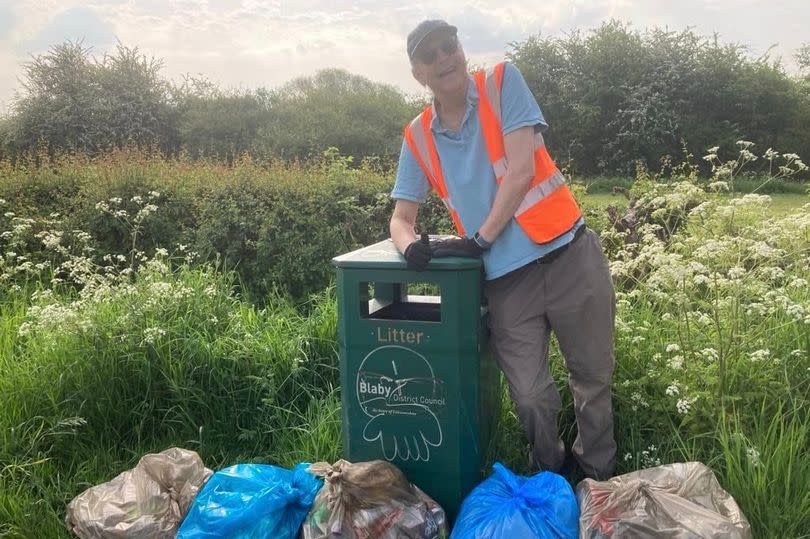 Keith Johnson with many bags of rubbish from his litter womble days