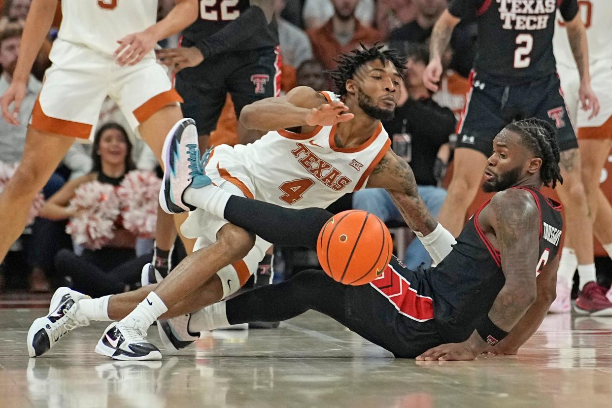 Texas guard Tyrese Hunter (4) draws a foul from Texas Tech guard Joe Toussaint (6) during the Big 12 basketball game, Saturday, Jan. 6, 2024, at Moody Center in Austin.