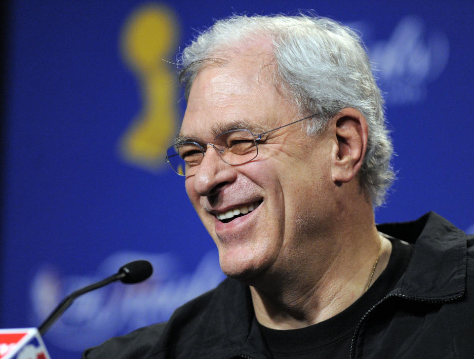 FILE - In this June 3, 2009 file photo, Los Angeles Lakers coach Phil Jackson answers question during a news conference after practice for Game 1 of the NBA final basketball series in Los Angeles. Carmelo Anthony says he has heard that 11-time NBA champion coach Phil Jackson will be "coming on board" in a leadership capacity with the New York Knicks, though cautioned that nothing is yet official. Anthony made the comments Wednesday, March 12, 2014, to reporters in Boston, where the Knicks are playing the Celtics.(AP Photo/Chris Carlson, File)