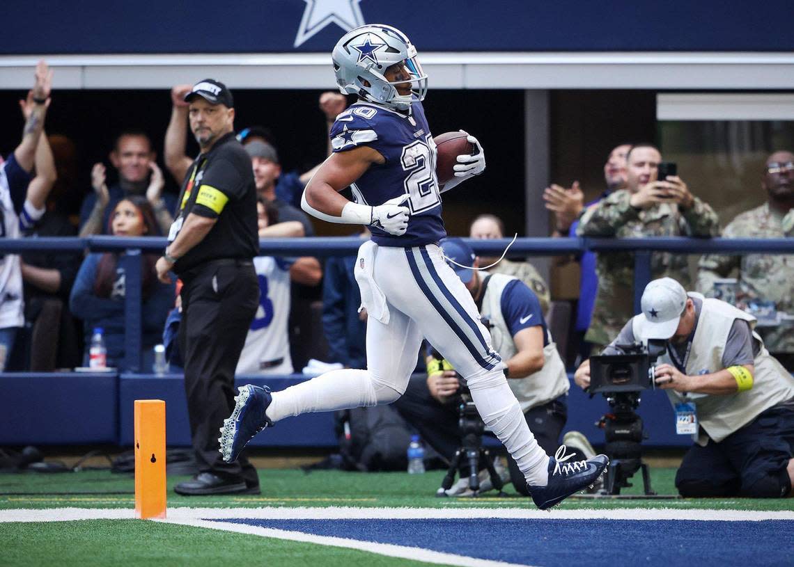 Dallas Cowboys running back Tony Pollard runs the ball into the end zone for a touchdown against the Chicago Bears on Sunday, October 30, 2022, at AT&T Stadium in Arlington.