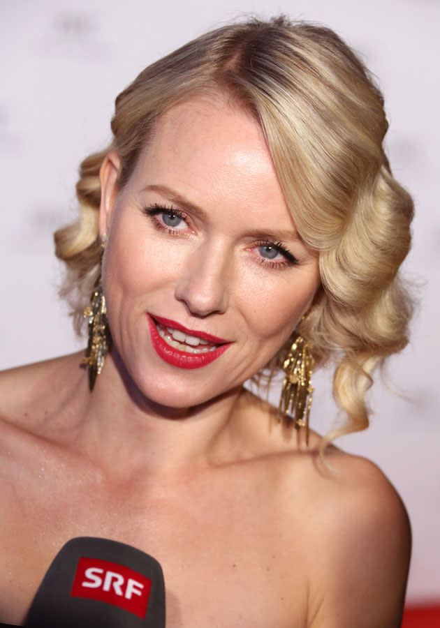 Celebrities wearing red lipstick: Naomi Watts worked the red lips trend with a chic up-do at Cannes.<p>[Rex]</p>