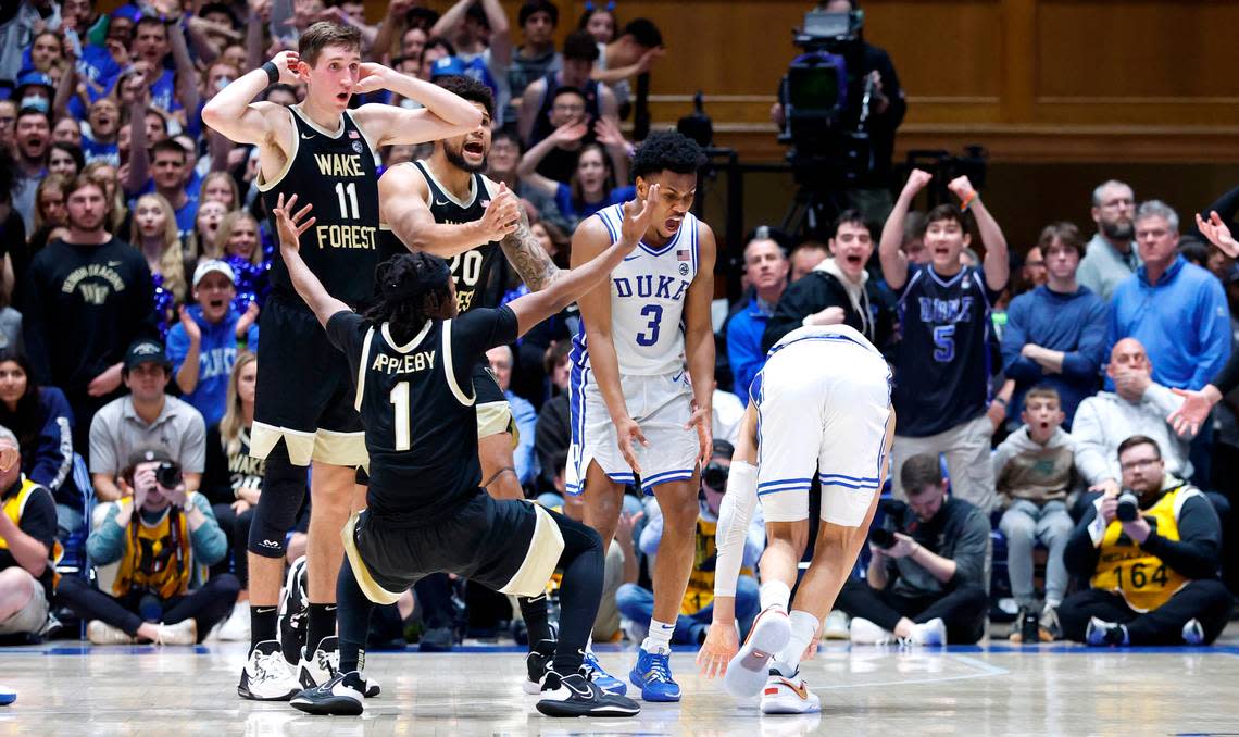 Duke’s Jeremy Roach (3) celebrates with Tyrese Proctor (5) after Wake Forest’s Tyree Appleby (1) was called for an offensive foul on Proctor with 42 seconds left in the game during Duke’s 75-73 victory over Wake Forest at Cameron Indoor Stadium in Durham, N.C., Tuesday, Jan. 31, 2023.
