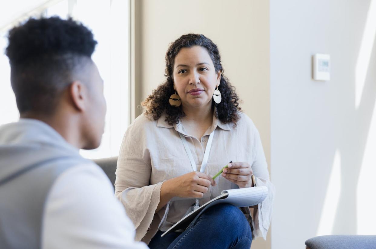 Student-to-counselor ratios in America's schools often exceed what is recommended. <a href="https://www.gettyimages.com/detail/photo/counselor-listens-royalty-free-image/1383919246?phrase=school+psychologist&adppopup=true" rel="nofollow noopener" target="_blank" data-ylk="slk:SDI Productions via Getty Images;elm:context_link;itc:0;sec:content-canvas" class="link ">SDI Productions via Getty Images</a>