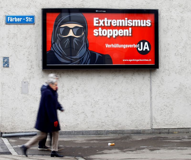 FILE PHOTO: A poster of the initiative committee against wearing the burqa is seen in Zurich