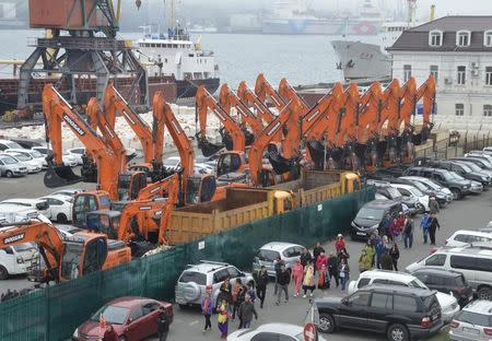 People arrive aboard the North Korean ferry, the Mangyongbong, at the port of the far eastern city of Vladivostok, Russia, May 18, 2017. REUTERS/Yuri Maltsev