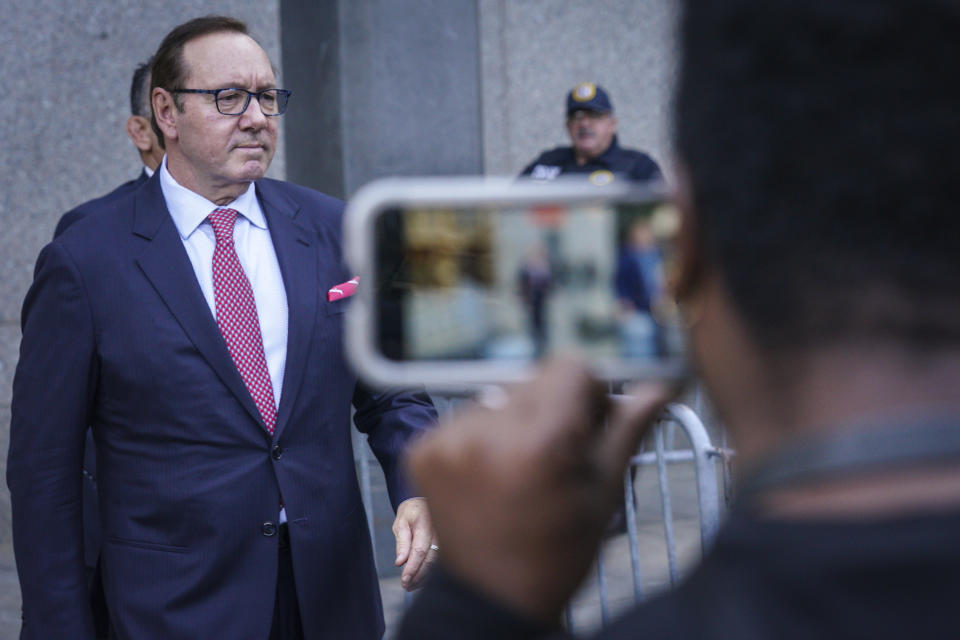 FILE - Actor Kevin Spacey leaves a court in New York, Tuesday, Oct. 11, 2022 following proceedings in a civil trial accusing him of sexually abusing a 14-year-old boy in the 1980s. Double Academy Award-winner Kevin Spacey goes on trial in London this week, accused of sexual offenses against four men in Britain. Spacey, 63, faces a dozen charges, which he denies. His trial starts Wednesday at Southwark Crown Court. (AP Photo/Bebeto Matthews, File)