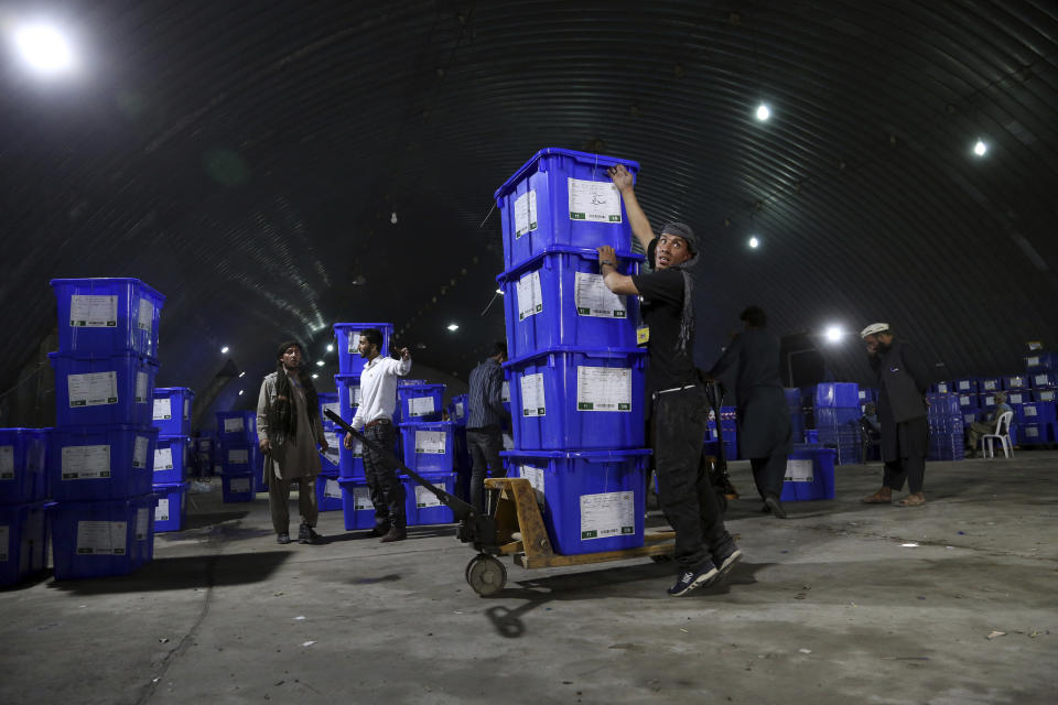 Election commission workers stack ballot boxes in preparation for the presidential election scheduled for Sept. 28, at the Independent Election Commission compound, in Kabul, Afghanistan, Wednesday, Sept. 18, 2019. Afghan officials say around 100,000 members of the country's security forces are ready for polling day. (AP Photo/Rahmat Gul)