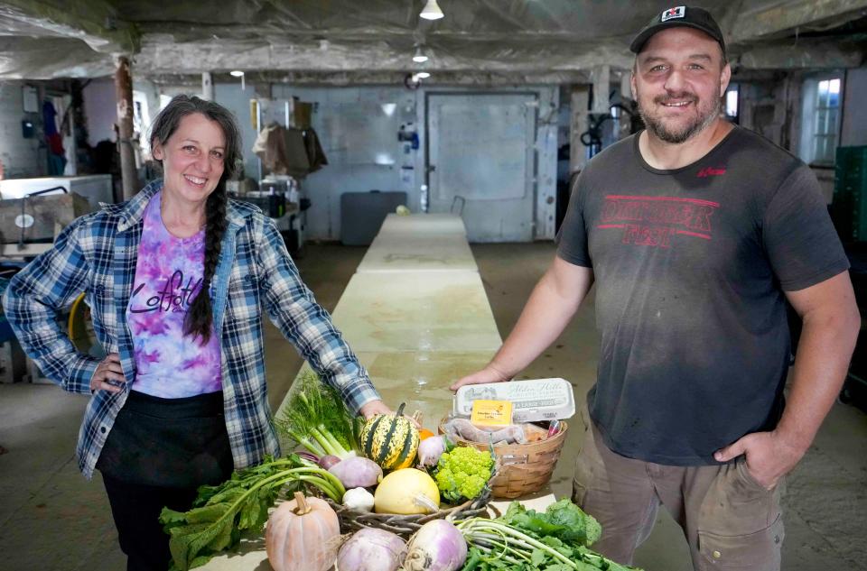 April Yuds and Tim Huth stand with produce from their farm, LotFotL, in Elkhorn on Oct. 5, 2023. The farm offers both a summer and winter CSA for customers supplemented with food from other local purveyors. "Our mission is to build community around sustainable food," Yuds said. "To me, that is what it is all about. It fits all my values, and I do the work that I love and that is important to me."