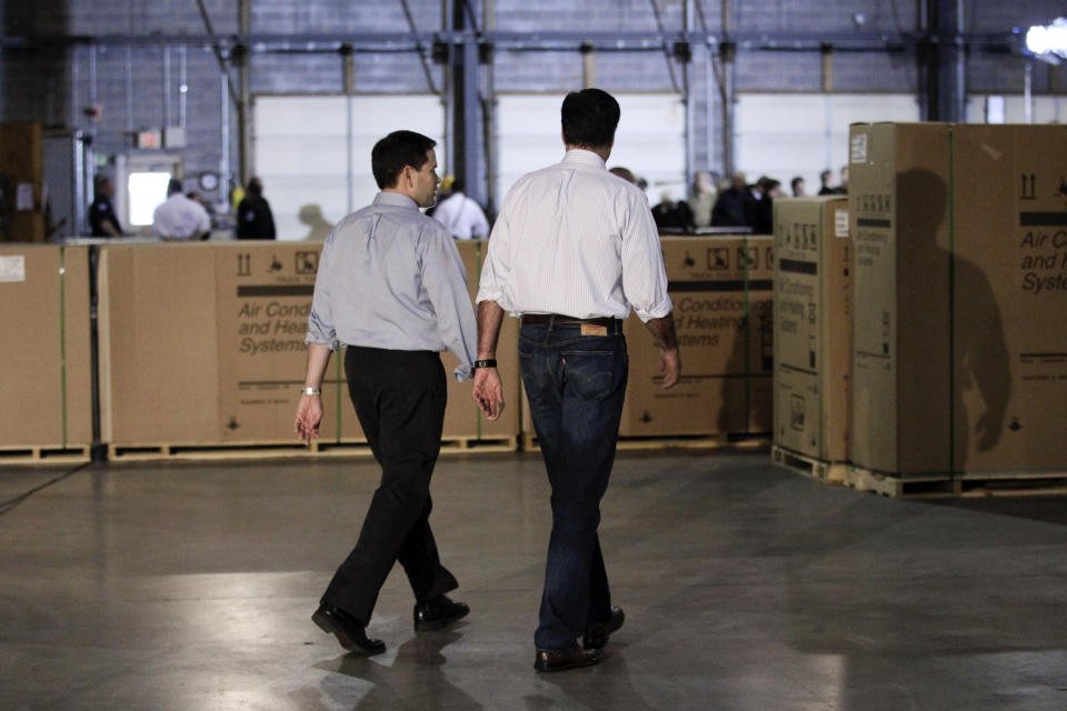 Republican presidential candidate, former Massachusetts Gov. Mitt Romney, right, walks with Sen. Marco Rubio, R-Fla., after talking to reporters prior to a town hall-style meeting in Aston, Pa., Monday, April 23, 2012. (AP Photo/Jae C. Hong)