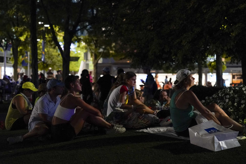 Tennis fans watch play between Serena Williams, of the United States, and Danka Kovinic, of Montenegro, during the first round of the US Open tennis championships, Monday, Aug. 29, 2022, in New York. (AP Photo/Julia Nikhinson)