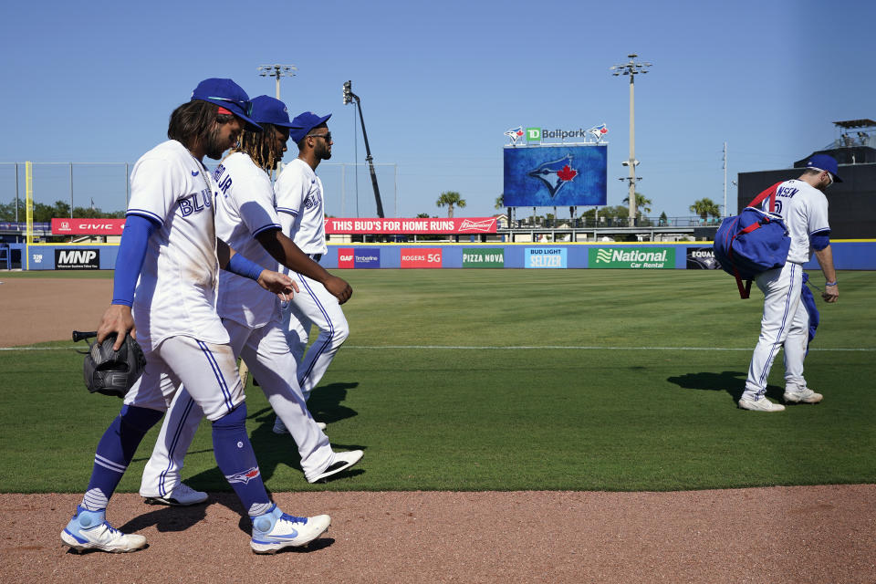 Toronto Blue Jays, from left, Bo Bichette, Vladimir Guerrero Jr., Lourdes Gurriel Jr., and Danny Jansen (9) walk off after an extra inning loss to the Tampa Bay Rays during a baseball game Monday, May 24, 2021, in Dunedin, Fla. The Blue Jays will be fininshing the rest of their home season in Buffalo. (AP Photo/Chris O'Meara)