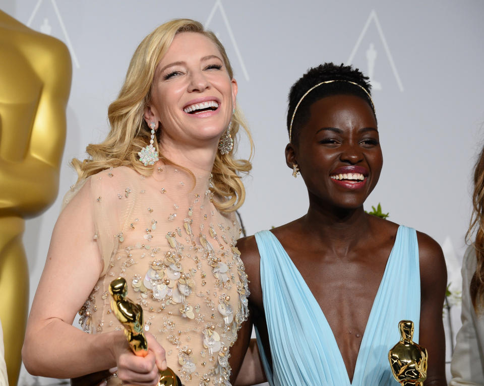 Cate Blanchett holds her award for best actress in "Blue Jasmine", left, and Lupita Nyong'o holds her award for best supporting actress for "12 Years a Slave," in the press room during the Oscars at the Dolby Theatre on Sunday, March 2, 2014, in Los Angeles. (Photo by Jordan Strauss/Invision/AP)