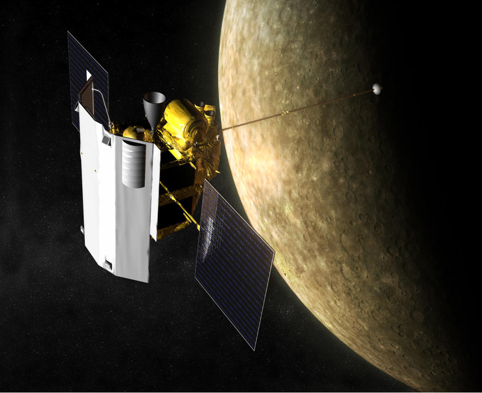 a rectangular spacecraft with two wing-like solar panels above a gray, cratered planet