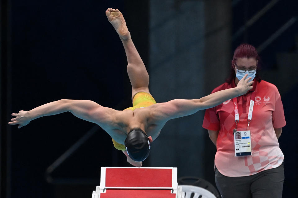 <p>South Korea's Moon Seung-woo dives to start in a heat for the men's 100m butterfly swimming event during the Tokyo 2020 Olympic Games at the Tokyo Aquatics Centre in Tokyo on July 29, 2021. (Photo by Jonathan NACKSTRAND / AFP) (Photo by JONATHAN NACKSTRAND/AFP via Getty Images)</p> 