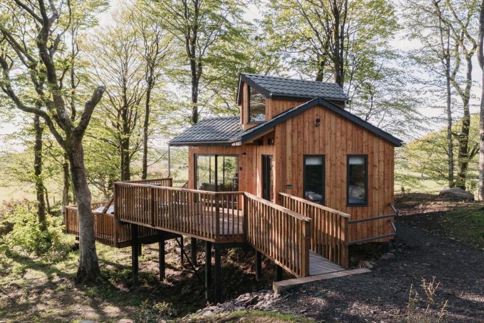 <p>Tucked away in West Wales sits this undeniably stunning treehouse property that is so beautiful, you’d think it was from your childhood fantasies. </p><p>A self-catered treehouse with a wood-fired pizza oven, WiFi (but digital detoxing is advised!) and an outdoor cedar clad hot tub, we wouldn’t blame you if you wanted to stay in this Scandi chic hideaway for the duration of your stay. We're big fans of the living area with views of the sea in the distance, as well as the soft furnishings and windows aplenty. </p><p>If you did want to venture out to the wilderness to stretch your legs and work up an appetite, eight miles down the road is Ceredigion coastline, the harbour town of Aberaeron and the Cambrian Mountains. The words ‘I’m bored’ are strictly a no-no. </p><p><a class="link " href="https://thewanderlist.uk/properties/cuckoos-hideaway/" rel="nofollow noopener" target="_blank" data-ylk="slk:BOOK HERE;elm:context_link;itc:0;sec:content-canvas">BOOK HERE</a> </p>