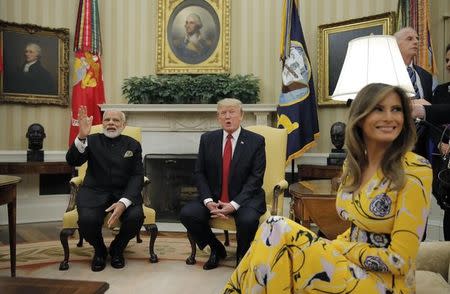 U.S. President Donald Trump (C) and first lady Melania Trump meet with Indian Prime Minister Narendra Modi in the Oval Office at the White House in Washington, U.S., June 26, 2017. REUTERS/Carlos Barria