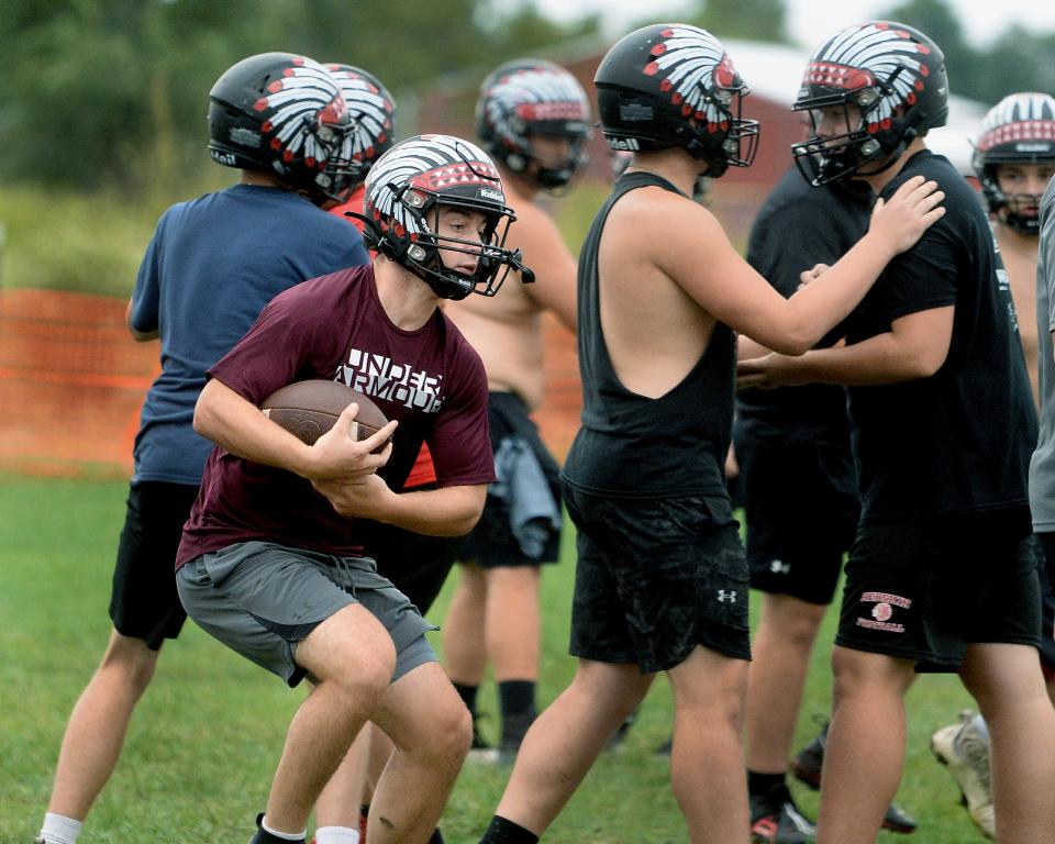 Nokomis High School's Nolan Herpstreith runs with the ball during a drill at football practice Tuesday, Sept. 24, 2024.