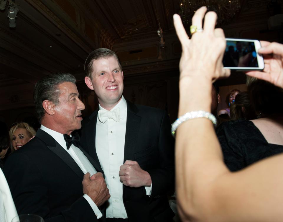Sylvester Stallone and Eric Trump pose for a photo at Mar-a-Lago Club Saturday December 31, 2016 in the Town of Palm Beach.
