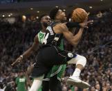 Feb 21, 2019; Milwaukee, WI, USA; Boston Celtics guard Jaylen Brown (7) defends Milwaukee Bucks forward Giannis Antetokounmpo (34) during the fourth quarter at Fiserv Forum. Mandatory Credit: Jeff Hanisch-USA TODAY Sports