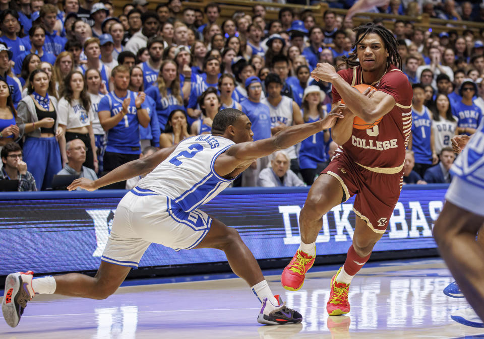 Boston College's DeMarr Langford Jr. (5) drives against Duke's Jaylen Blakes (2) during the first half of an NCAA college basketball game in Durham, N.C., Saturday, Dec. 3, 2022. (AP Photo/Ben McKeown)