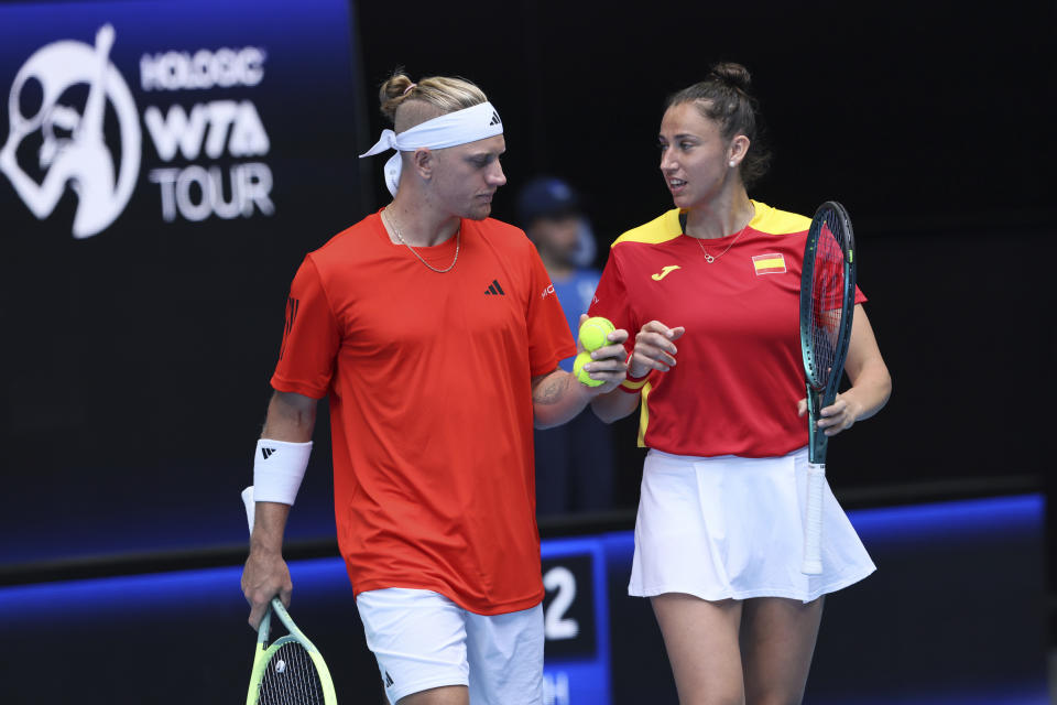 Alejandro Davidovich Fokina of Spain talks to partner Sara Sorribes Tormo during their mixed doubles match against Beatriz Haddad Maia and Marcelo Melo of Brazil at the United Cup tennis tournament in Perth, Australia, Friday, Dec. 29, 2023. (AP Photo/Trevor Collens)