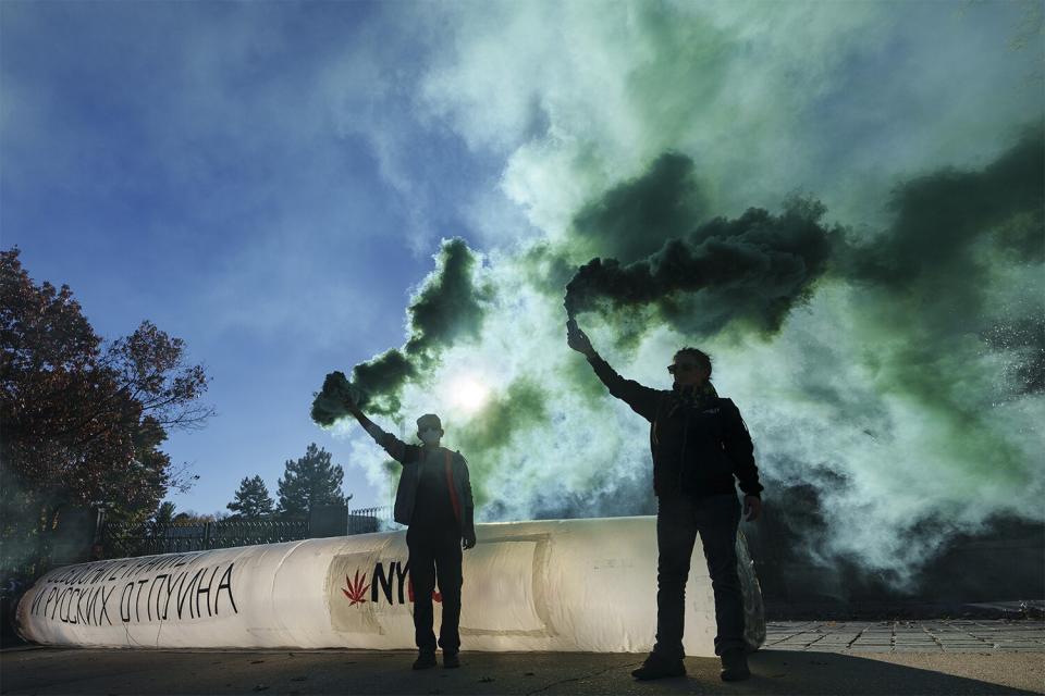 WASHINGTON, DC - OCTOBER 27: Cannabis advocates deploy green smoke and a fake inflatable joint outside the Russian Embassy to demand the release of American basketball star Brittney Griner, who has been imprisoned in Russia since February for cannabis possession, October 27, 2022 in Washington, DC. Earlier this week, a Russian appeals court upheld a nine-year prison sentence imposed on Griner. According to the Biden administration, Russia and the United States have been in frequent contact about a potential prisoner exchange involving Griner and others. (Photo by Drew Angerer/Getty Images)