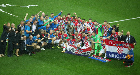 Soccer Football - World Cup - Final - France v Croatia - Luzhniki Stadium, Moscow, Russia - July 15, 2018 Croatia players and staff celebrate on the pitch after the match REUTERS/Michael Dalder