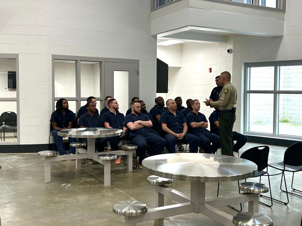 Madison Co. Sheriff Julian Wiser speaks to inmates moments before they graduate with their certificate in manufacturing skills at the Madison Co. Jail in Jackson, Tenn., and June 15, 2023.
