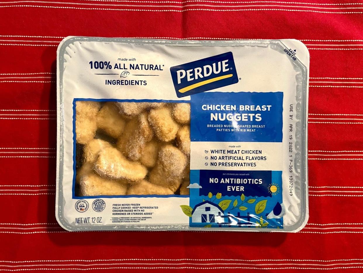 A flat Perdue package that says "chicken breast nuggets" with a screen showing the frozen chicken nuggets inside.
