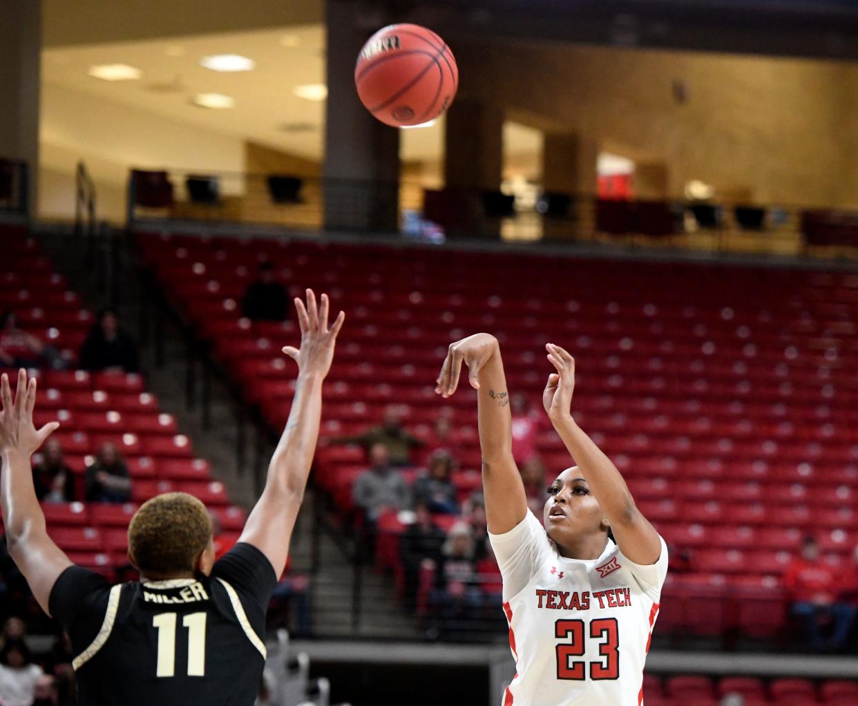 Texas Tech's guard Bre'Amber Scott (23) shoots a three-point shot against Colorado in a preseason WNIT game, Wednesday, Nov. 16, 2022, at United Supermarkets Arena. 