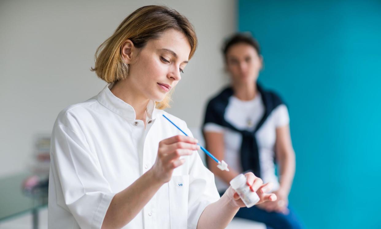 <span>The NHS is urging all women to attend cervical screening even if they are vaccinated.</span><span>Photograph: Phanie/Alamy</span>