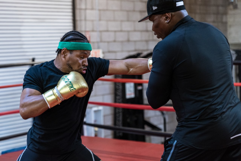 Shawn Porter, left, trains with his father, Kenny Porter.