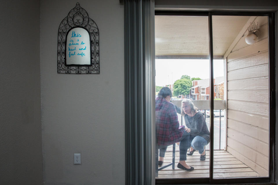 Donna Bloom, director of legal services at Denton County Friends of the Family, visits Amanda at the transitional housing. (Photo: Mei-Chun Jau for HuffPost)