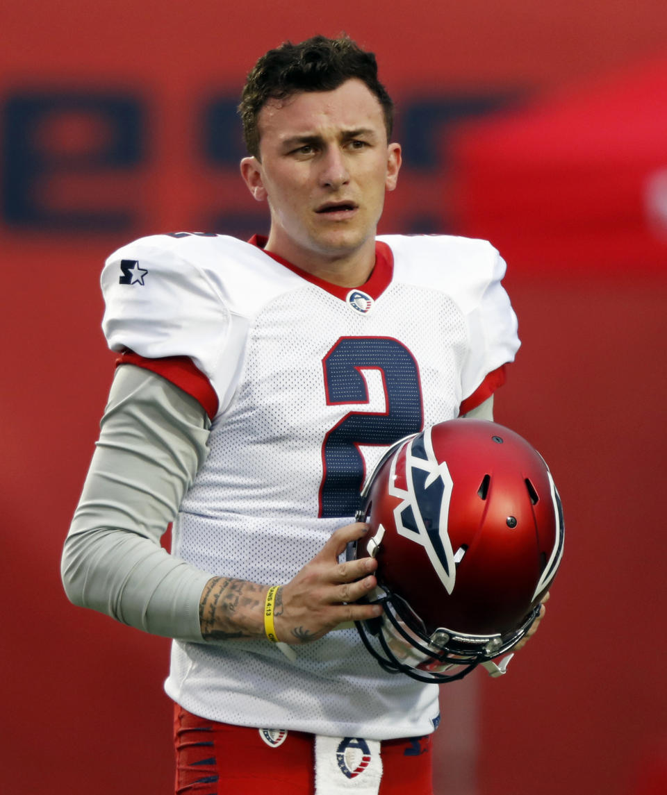 FILE- In this March 24, 2019, file photo,Memphis Express quarterback Johnny Manziel looks on before an AAF football game against the Birmingham Iron in Memphis, Tenn. After a self-destructing pro career that never close to matching his enormous potential, Manziel says he's done with the game that gave him his catchy moniker (Johnny Football), even as he's dabbling in a fledgling, fan-controlled arena league that was set to begin play Saturday night in suburban Atlanta. (AP Photo/Wade Payne, File)