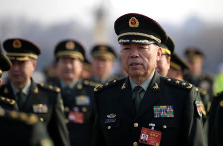 Military delegates from the Chinese People's Liberation Army (PLA) walk toward the Great Hall of the People for a meeting during the annual session of China's parliament, the National People's Congress (NPC), in Beijing, China March 4, 2017. REUTERS/Jason Lee