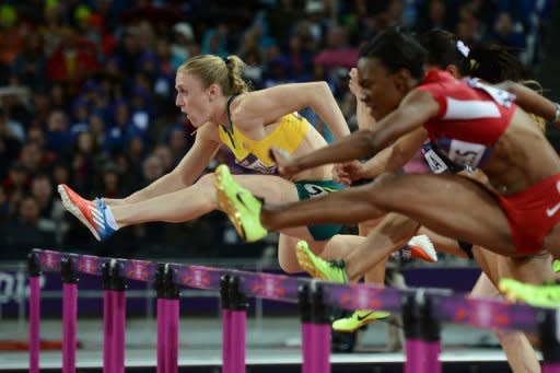 Australia's Sally Pearson (L) competes in the women's 100m hurdles final at the athletics event during the London 2012 Olympic Games on August 7, 2012 in London. Pearson clocked an Olympic record of 12.35sec