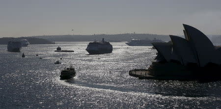 The Manly-bound ferry Collaroy (foreground) picks its way between cruise ships Pacific Jewel (C) and Pacific Aria during a naming ceremony for the new P&O cruise ships on Sydney harbour, November 25, 2015. REUTERS/Jason Reed