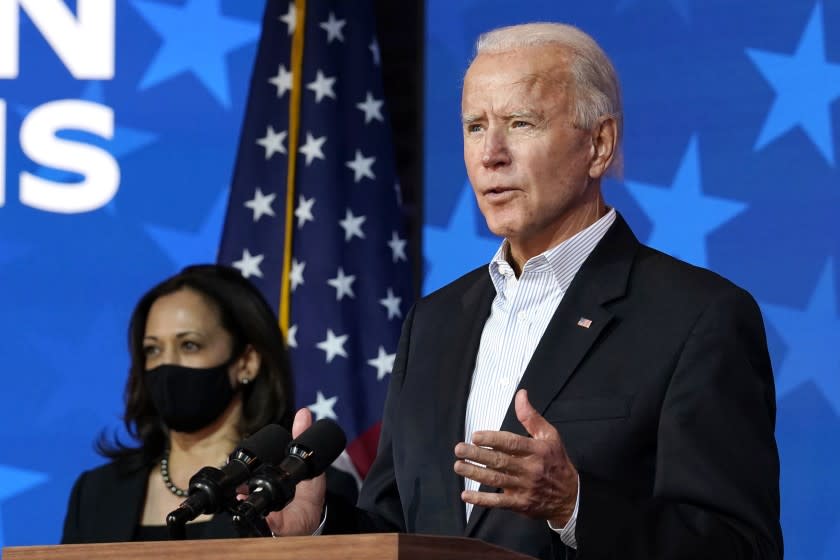 Democratic presidential candidate former Vice President Joe Biden speaks Thursday, Nov. 5, 2020, in Wilmington, Del. Democratic vice presidential candidate Sen. Kamala Harris, D-Calif., stands at left. (AP Photo/Carolyn Kaster)