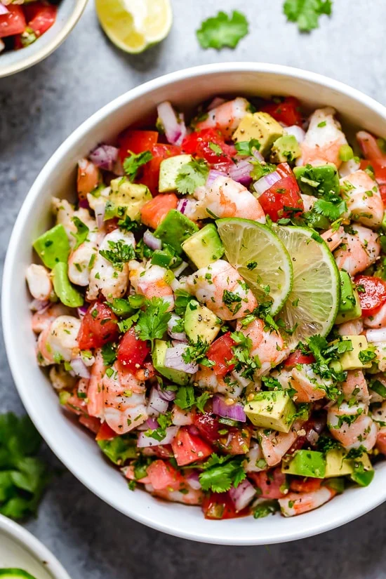 Shrimp ceviche salad with avocado, tomato, and onions.