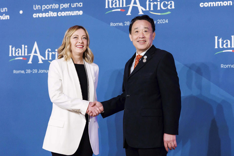 Italian Premier Giorgia Meloni, left, welcomes United Nations Food and Agriculture Organization (FAO) Director-General Qu Dongyu on the occasion of an Italy - Africa summit, in Rome, Monday, Jan. 29, 2024. Meloni opened a summit of African leaders on Monday aimed at illustrating Italy's big development plan for the continent that her government hopes will stem migration flows and forge a new relationship between Europe and Africa. (Roberto Monaldo/LaPresse via AP)