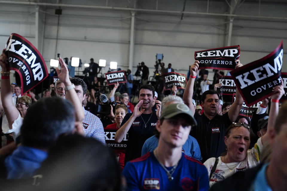 The crowd cheers as former Vice President Mike Pence speaks on behalf of Georgia Gov. Brian Kemp during a rally, Monday, May 23, 2022, in Kennesaw, Ga. Pence is opposing former President Donald Trump and his preferred Republican candidate for Georgia governor, former U.S. Sen. David Perdue. (AP Photo/Brynn Anderson)