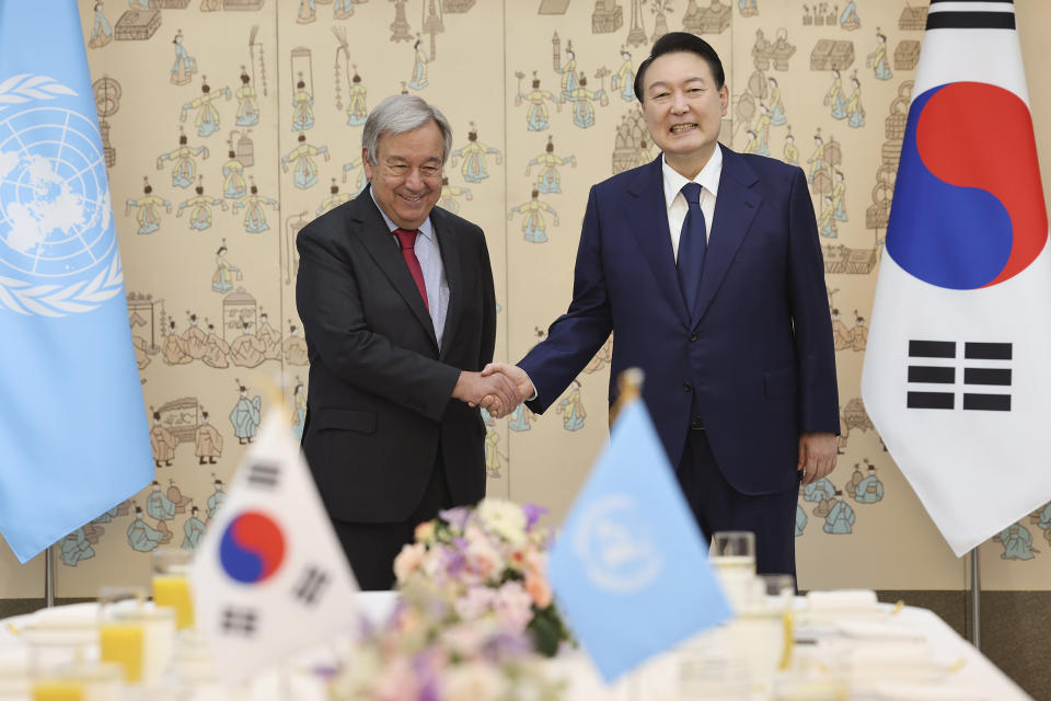 South Korean President Yoon Suk Yeol, right, shakes hands with Secretary-General of the United Nations Antonio Guterres during a meeting at the presidential office in Seoul, South Korea, Friday, Aug. 12, 2022. (Suh Myung-geon/Yonhap via AP)